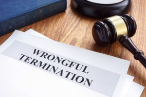 Wrongful termination document on the table.